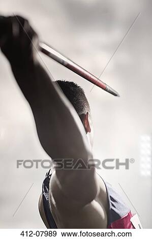Track and field athlete holding javelin View Large Photo Image Stock Photo - Track and field athlete holding javelin. Fotosearch