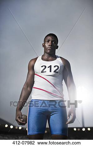 Track and field athlete holding shot put View Large Photo Image Stock Image - Track and field athlete holding shot put. Fotosearch