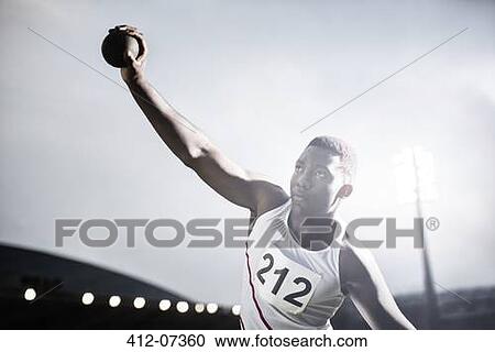 Track and field athlete throwing shot put View Large Photo Image Stock Image - Track and field athlete throwing shot put. Fotosearch