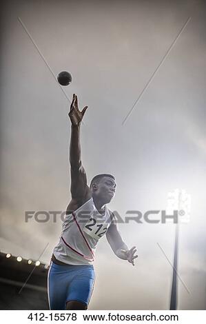 Track and field athlete throwing shot put View Large Photo Image Stock Photo - Track and field athlete throwing shot put. Fotosearch