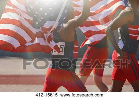 Track and field athletes holding American flags on track View Large Photo Image Stock Photography - Track and field athletes holding American flags on track. Fotosearch