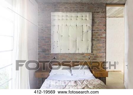 Stock Photo - Wall hanging in modern bedroom. Fotosearch