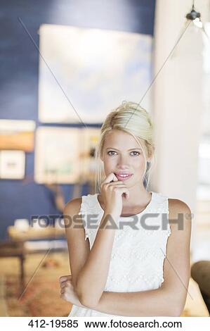 Woman holding her chin in hand View Large Photo Image Stock Photography - Woman holding her chin in hand. Fotosearch