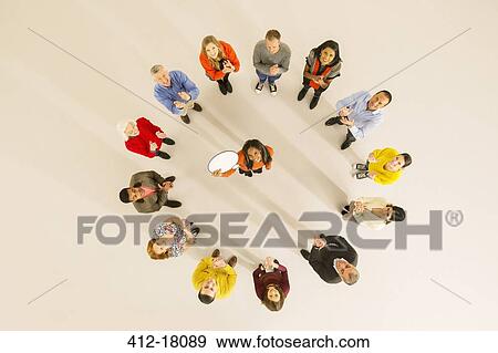 Stock Photo - Woman holding thought bubble in circle. Fotosearch