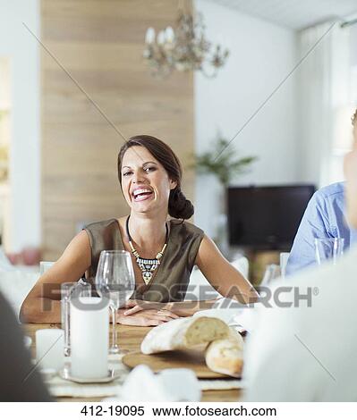 Woman laughing at dinner party View Large Photo Image Stock Photography - Woman laughing at dinner party. Fotosearch