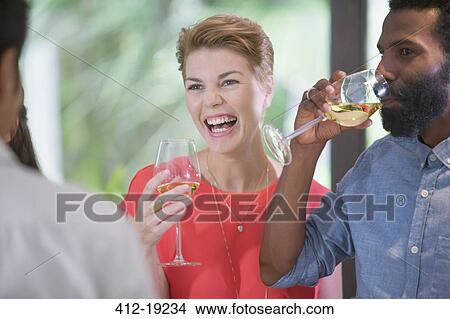 Woman laughing at party View Large Photo Image Picture - Woman laughing at party. Fotosearch