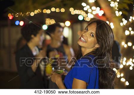 Woman laughing at party View Large Photo Image Stock Image - Woman laughing at party. Fotosearch