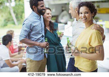 Stock Photo - Woman smiling at party. Fotosearch