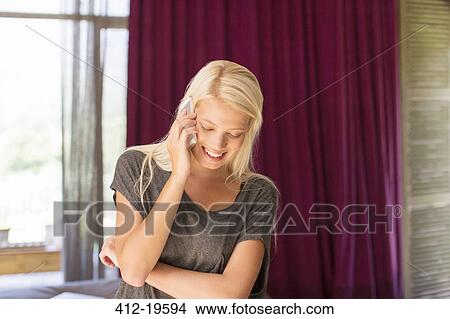 Woman talking on cell phone View Large Photo Image Picture - Woman talking on cell phone. Fotosearch