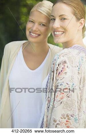 Women smiling together outdoors View Large Photo Image Stock Photography - Women smiling together outdoors. Fotosearch