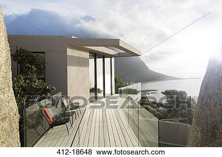 Stock Photo - Wooden balcony of modern house. Fotosearch