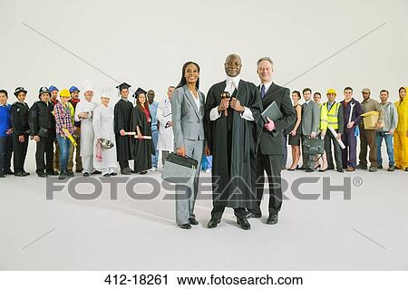 Stock Image - Workforce behind confident judge and lawyers. Fotosearch