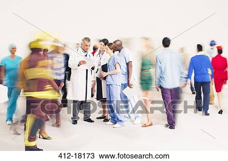 Workforce bustling around doctors and nurses View Large Photo Image Stock Image - Workforce bustling around doctors and nurses. Fotosearch