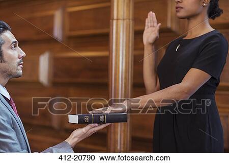Bailiff giving oath to witness View Large Photo Image Stock Image - Bailiff giving oath to witness. Fotosearch