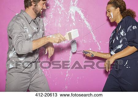 Couple playing with paint together View Large Photo Image Stock Image - Couple playing with paint together. Fotosearch