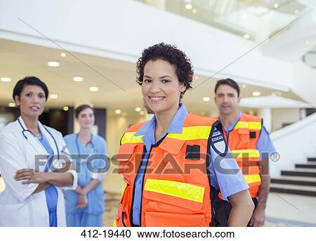 Doctor, nurse and paramedics standing in hospital View Large Photo Image Stock Image - Doctor, nurse and paramedics standing in hospital. Fotosearch