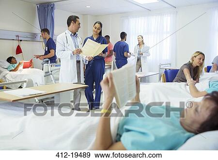 Doctors, nurses and patients in hospital room View Large Photo Image Stock Photo - Doctors, nurses and patients in hospital room. Fotosearch