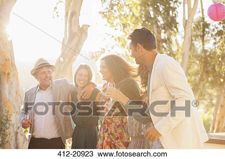 Stock Image - Family celebrating with drinks. Fotosearch