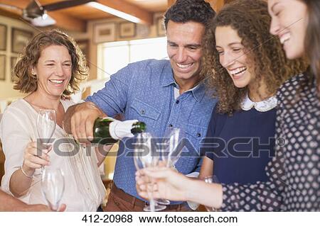 Family celebrating with drinks View Large Photo Image Stock Photo - Family celebrating with drinks. Fotosearch
