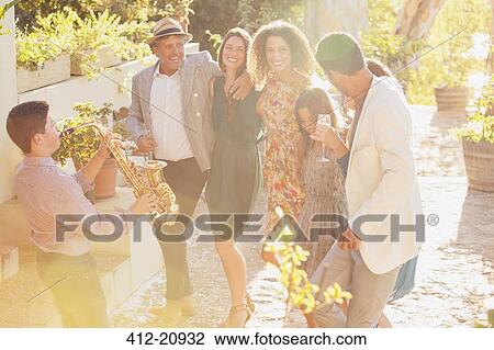 Family dancing together outdoors View Large Photo Image Stock Image - Family dancing together outdoors. Fotosearch