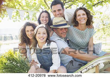 Family hugging outdoors at picnic View Large Photo Image Stock Photo - Family hugging outdoors at picnic. Fotosearch