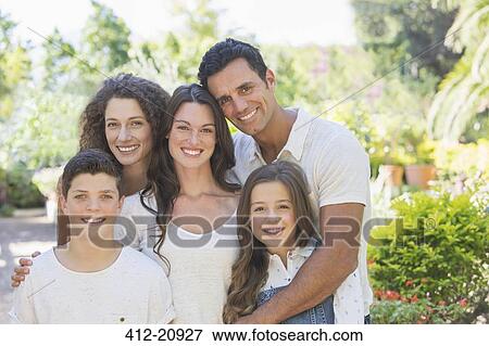 Family hugging outdoors View Large Photo Image Stock Photo - Family hugging outdoors . Fotosearch