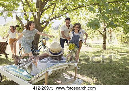 Family playing together outdoors View Large Photo Image Stock Photography - Family playing together outdoors. Fotosearch