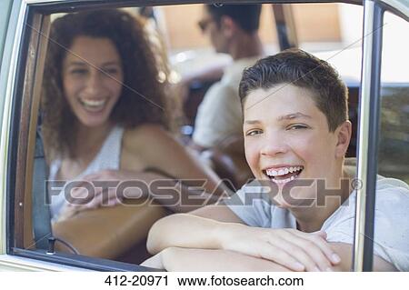 Family riding in car together View Large Photo Image Stock Image - Family riding in car together. Fotosearch