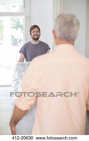 Father and son carrying couch View Large Photo Image Stock Image - Father and son carrying couch. Fotosearch
