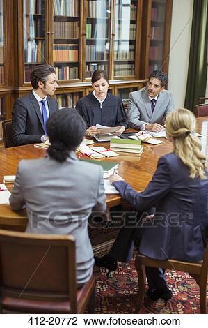Judge and lawyers talking in chambers View Large Photo Image Stock Image - Judge and lawyers talking in chambers. Fotosearch