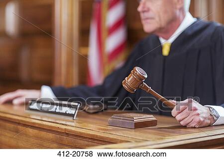 Stock Photo - Judge banging gavel in court. Fotosearch