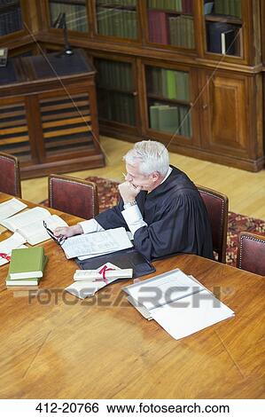 Judge doing research in courthouse View Large Photo Image Stock Photograph - Judge doing research in courthouse. Fotosearch
