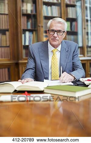 Stock Photo - Lawyer doing research in chambers. Fotosearch
