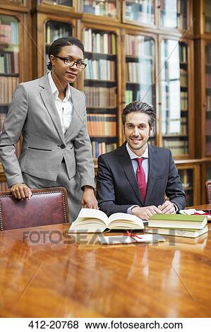 Lawyers doing research together in chambers View Large Photo Image Stock Photo - Lawyers doing research together in chambers. Fotosearch
