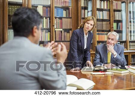 Lawyers talking in chambers View Large Photo Image Stock Photograph - Lawyers talking in chambers. Fotosearch