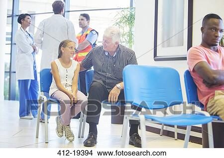 Man and granddaughter sitting in hospital waiting room View Large Photo Image Picture - Man and granddaughter sitting in hospital waiting room. Fotosearch