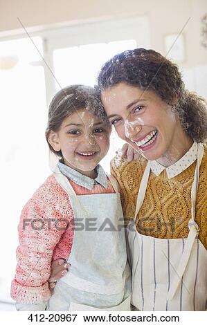 Mother and daughter playing with flour in the kitchen View Large Photo Image Stock Photo - Mother and daughter playing with flour in the kitchen. Fotosearch