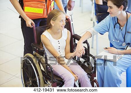 Nurse and patient holding hands in hospital View Large Photo Image Stock Image - Nurse and patient holding hands in hospital. Fotosearch