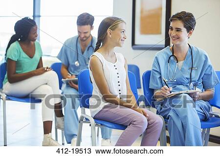 Nurse and patient talking in hospital View Large Photo Image Stock Image - Nurse and patient talking in hospital. Fotosearch