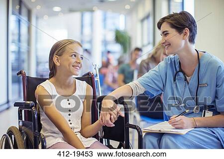 Nurse holding patient's hands in hospital View Large Photo Image Stock Image - Nurse holding patient's hands in hospital. Fotosearch
