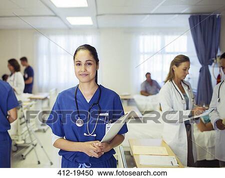 Nurse smiling in hospital room View Large Photo Image Stock Image - Nurse smiling in hospital room. Fotosearch