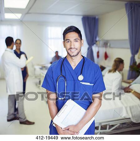 Stock Photo - Nurse smiling in hospital room. Fotosearch