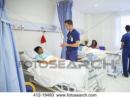 Nurse talking to patient in hospital room View Large Photo Image Stock Image - Nurse talking to patient in hospital room. Fotosearch