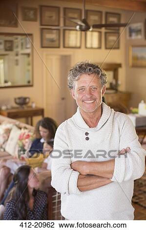 Older man smiling with family near View Large Photo Image Stock Image - Older man smiling with family near . Fotosearch