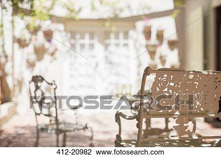 Outdoor dinning table on backyard patio View Large Photo Image Stock Image - Outdoor dinning table on backyard patio. Fotosearch