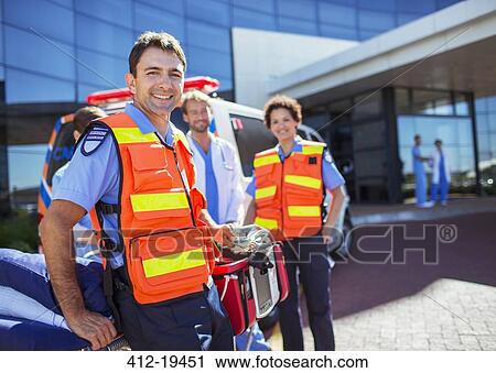 Paramedics smiling outside hospital View Large Photo Image Stock Image - Paramedics smiling outside hospital. Fotosearch