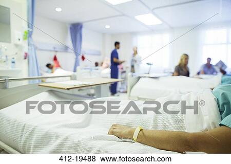 Stock Photo - Patient laying in hospital bed. Fotosearch