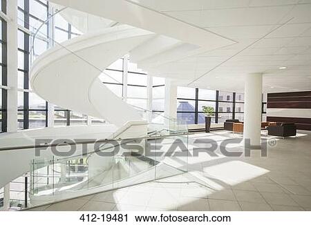 Spiral staircase in modern building View Large Photo Image Stock Image - Spiral staircase in modern building. Fotosearch