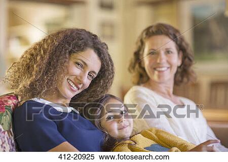 Three generations of women relaxing on couch together View Large Photo Image Stock Photography - Three generations of women relaxing on couch together. Fotosearch