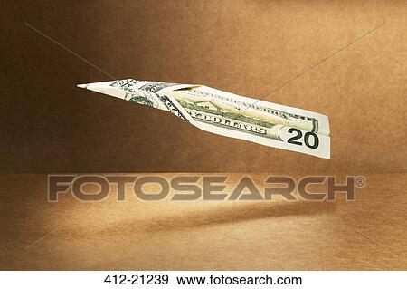 20 dollar bill folded into paper airplane View Large Photo Image Stock Photo - 20 dollar bill folded into paper airplane. Fotosearch